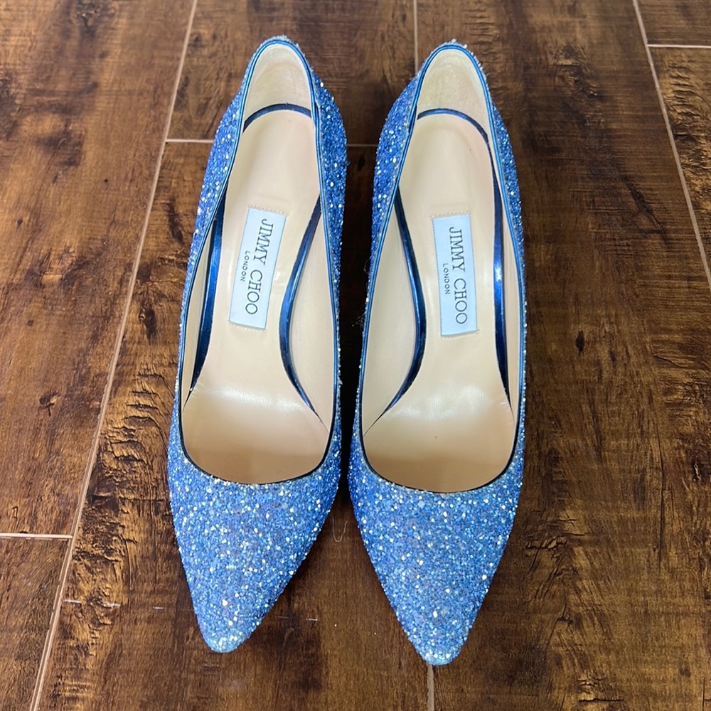 Size 38.5 Jimmy Choo Pumps. Barely worn! Blue sparkle shoe with black shiny heel
